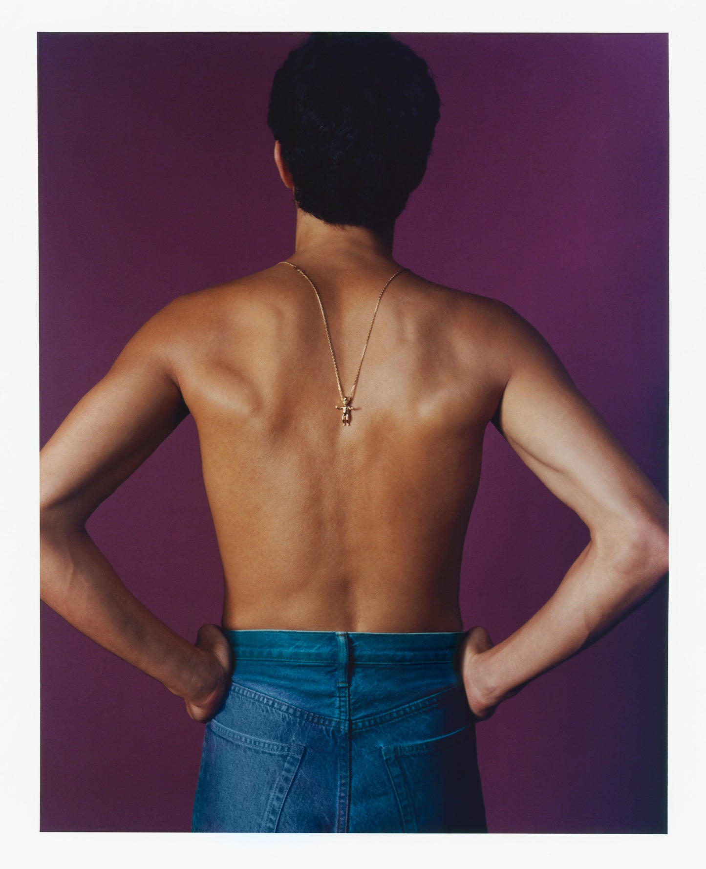 Man wearing ALF Jewelry Baby Necklace in 18ct gold vermeil with tsavorite and diamond, handcrafted Paris jewelry