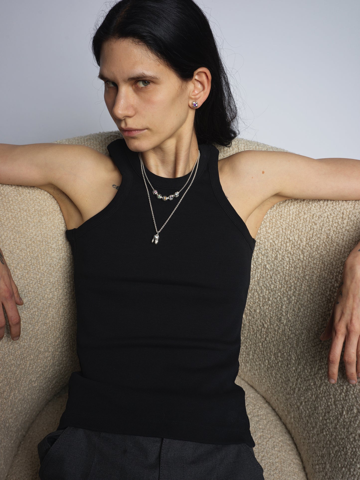 Female model wearing Alf molar pendant necklace in 925 sterling silver - made in FRance, designer luxury jewelry